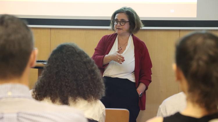 Dr. Sophie Meunier giving a talk in Singapore